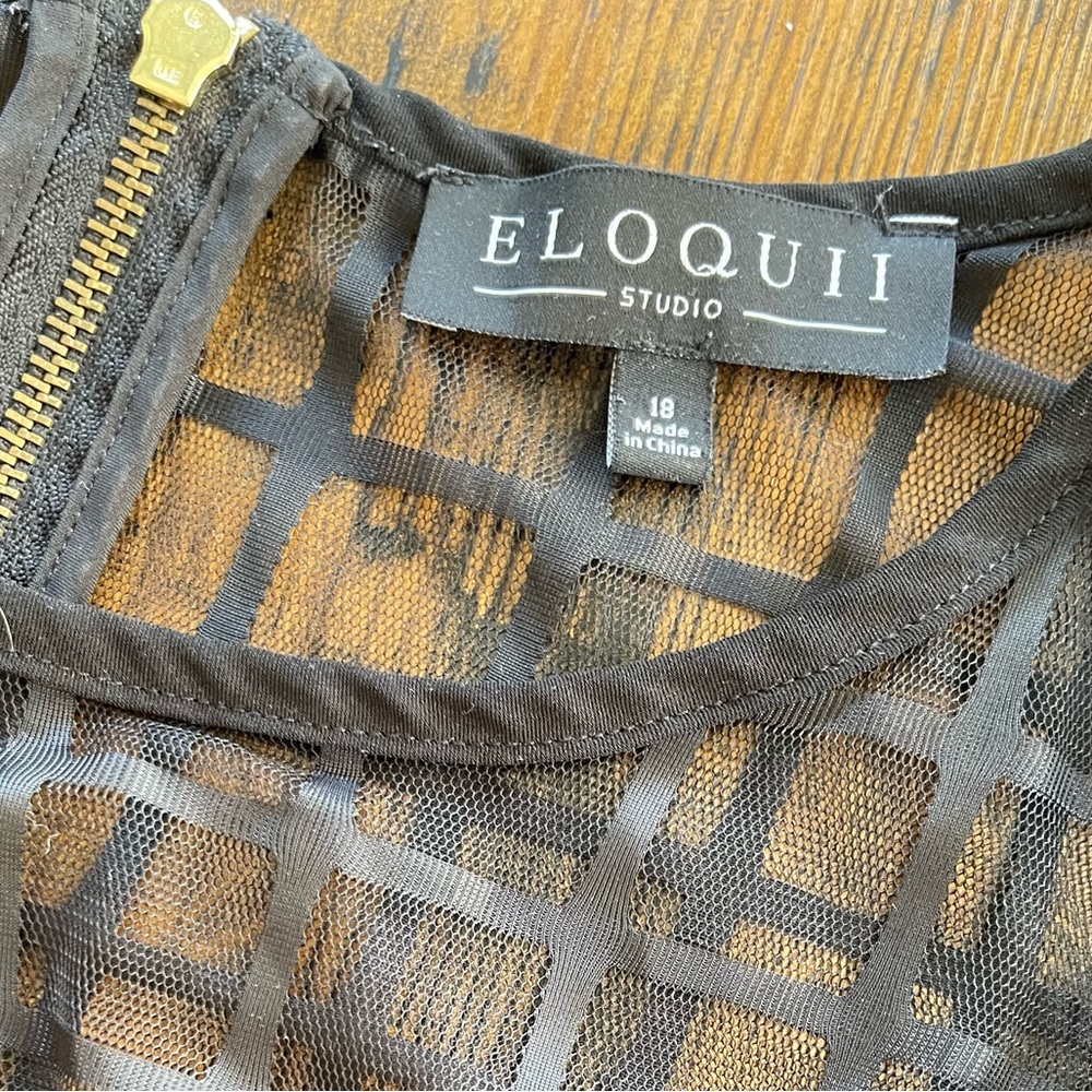 Black Eloquii jumpsuit with mesh windowpane neckline